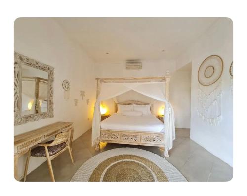 a bedroom with a white bed and a mirror at Cozzy room in heart of Canggu#1 in Canggu