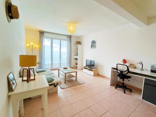 a living room with a couch and a table at Détente en provence in Digne-les-Bains