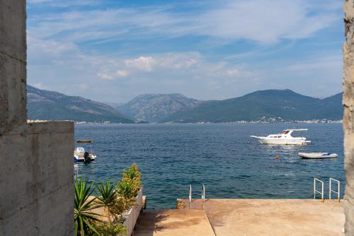 a view of a large body of water with boats at Villa Sonja Apartments in Krasici