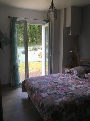 Postel nebo postele na pokoji v ubytování Les Patiences