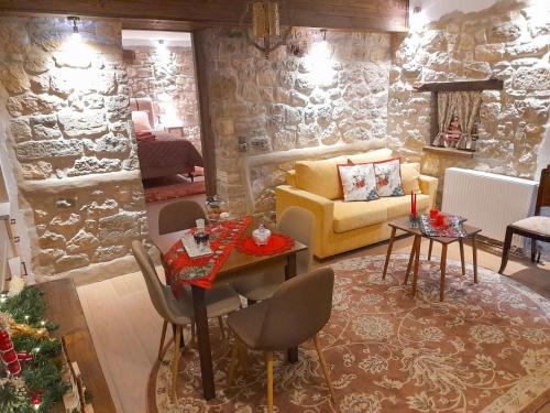 a living room with a couch and a table at Elen's Suites Pramanta in Pramanta