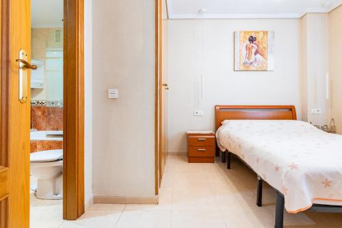Postel nebo postele na pokoji v ubytování Acapulco 3