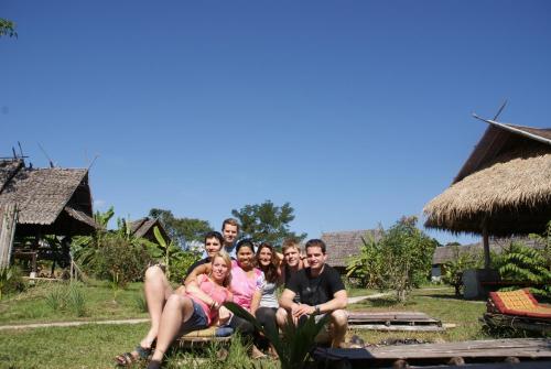 a group of people posing for a picture at Ing Doi Guest House in Pai