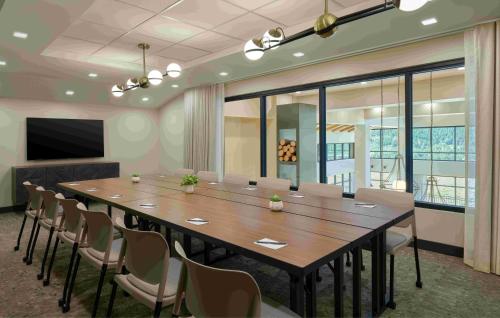 a large conference room with a large table and chairs at TownePlace Suites by Marriott Avon Vail Valley in Avon