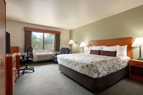 Ένα ή περισσότερα κρεβάτια σε δωμάτιο στο AmericInn by Wyndham Havre