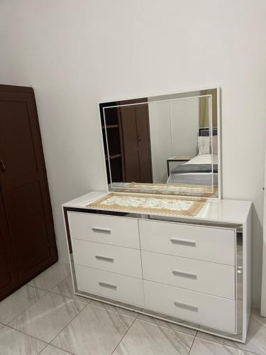 a dresser with a mirror on top of it at D & M home away from home in Lennansville
