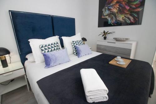 Ένα ή περισσότερα κρεβάτια σε δωμάτιο στο Trinidad Aparment