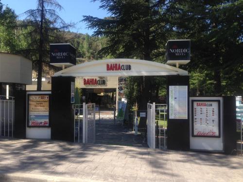 a gas station with two open doors and signs at Segovia Sierra de Guadarrama in Los Ángeles de San Rafael