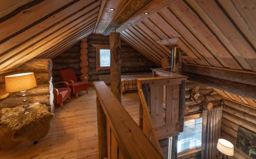 Ένα ή περισσότερα κρεβάτια σε δωμάτιο στο Wilderness Hotel Nellim & Igloos