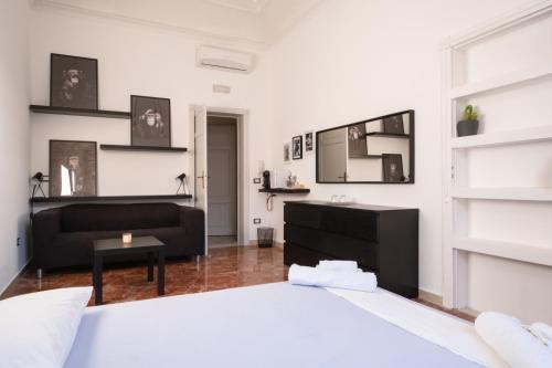Postel nebo postele na pokoji v ubytování Dal Commediante Apartment and Room