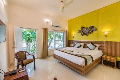 Postel nebo postele na pokoji v ubytování Vihar Holiday Resorts