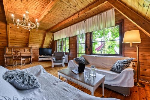 a living room with a couch and a table at Hanna House in Świeradów-Zdrój
