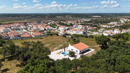 an aerial view of a small village with a white house at Monte da Boavista in Alcácer do Sal