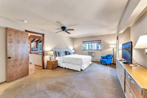 a bedroom with a bed and a flat screen tv at Northstar Retreat by Golf Course & Free Shuttle in Truckee