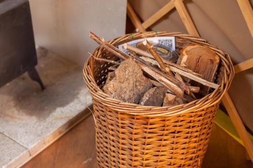 a wicker basket filled with rocks and sticks at Oak Yurt in Kent