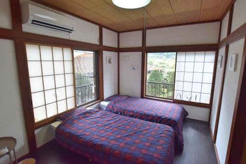 Postel nebo postele na pokoji v ubytování GATE Yamanashi Tsuru