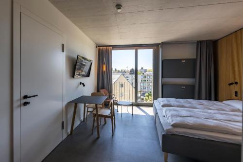 Postel nebo postele na pokoji v ubytování Zleep Hotel Zürich-Kloten