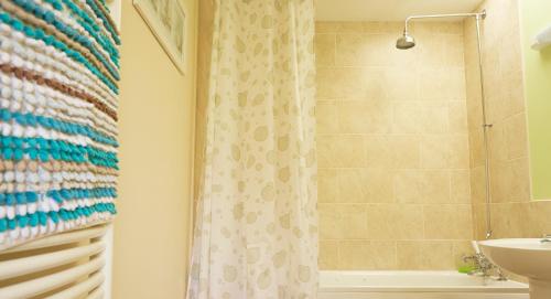 a bathroom with a shower and a sink at Filey Holiday Cottages in Filey