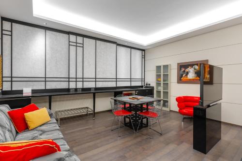 a living room with a couch and a table at Art Hotel Commercianti in Bologna