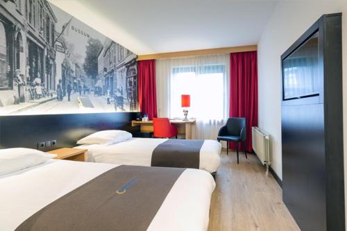 Postel nebo postele na pokoji v ubytování Bastion Hotel Bussum Hilversum