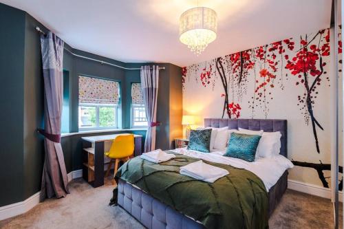 a bedroom with a bed and a desk in it at Spacious Comfort for Contractors & Long-Term Guests in Saighton