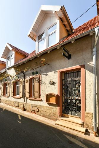 a building with a door on the side of a street at Ferienloft 'Weinstube Fridrich' in Bad Dürkheim