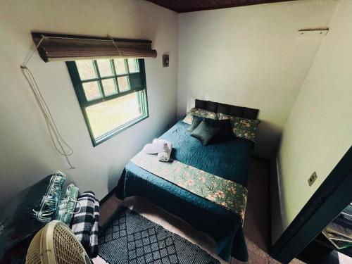 Katil atau katil-katil dalam bilik di Casa Aconchegante próximo a LUMIAR