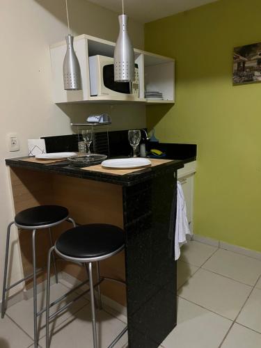 Kuchyň nebo kuchyňský kout v ubytování Refúgio Village das águas bloco B apt 106