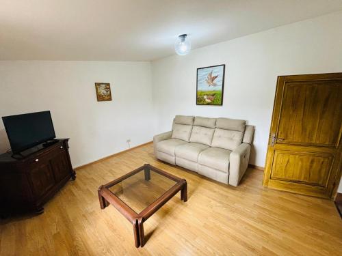 a living room with a couch and a coffee table at Predio Palazzo in Acquapendente