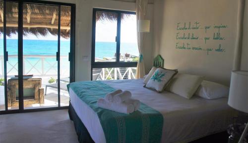 Ένα ή περισσότερα κρεβάτια σε δωμάτιο στο Punta Piedra Beach Posada