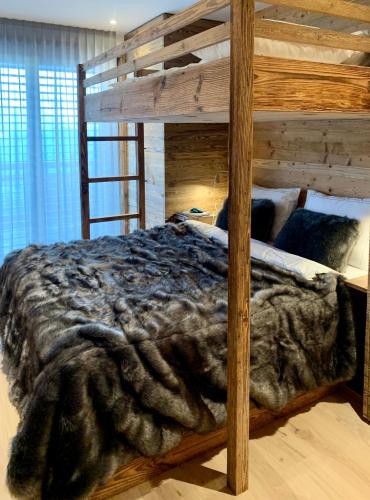 Ένα ή περισσότερα κρεβάτια σε δωμάτιο στο Luxury chalet apartment 4 Valleys