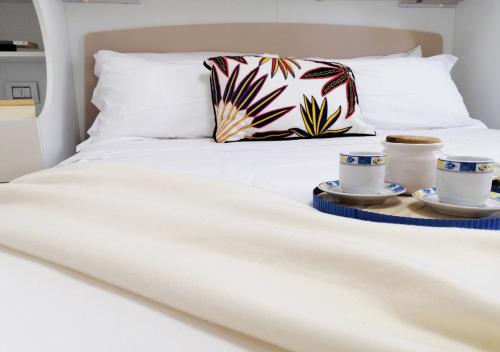 Postel nebo postele na pokoji v ubytování Holihome - Appartamento LA GIOIA