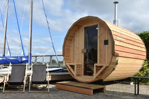 a small wooden boat sitting on top of a table at Het Toppunt groot vakantiehuis aan het water in Sneek