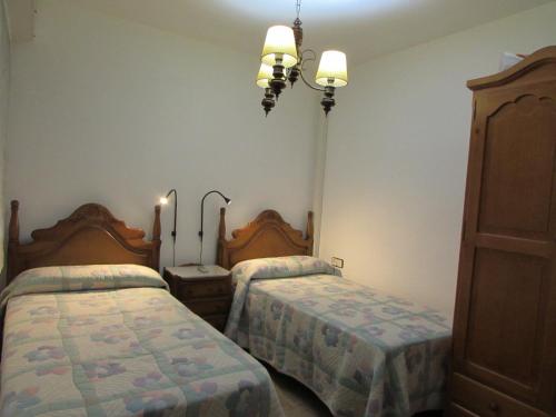 En eller flere senge i et værelse på AGUADULCE BEACH FRoNT