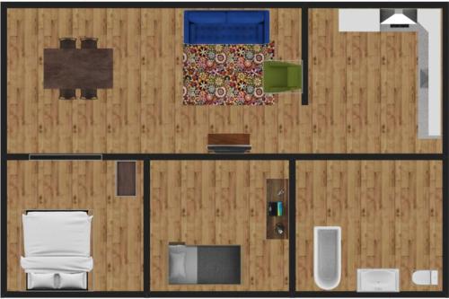 an overhead view of a room with a wooden wall at Cozy Bungalow 10 Min to DTWN CLE in Euclid