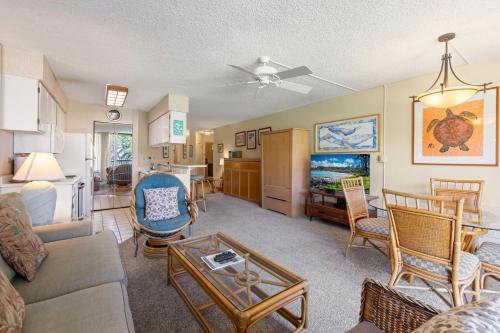 a living room with a couch and a table at Maui Sunset B211 in Kihei