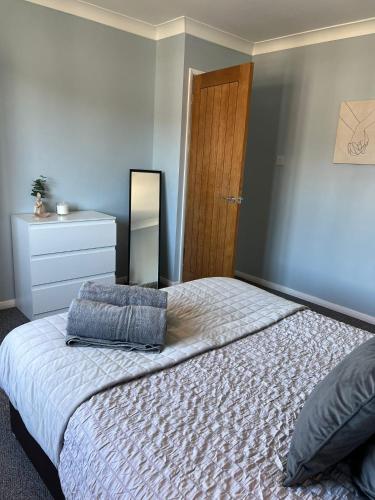 Postel nebo postele na pokoji v ubytování Oakfield Apartment