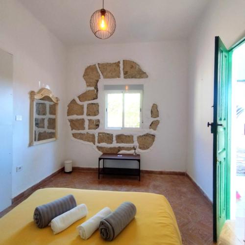 Ένα ή περισσότερα κρεβάτια σε δωμάτιο στο La Casita