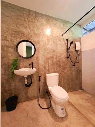 a bathroom with a toilet and a sink at Alissia House No 516 in Koh Tao