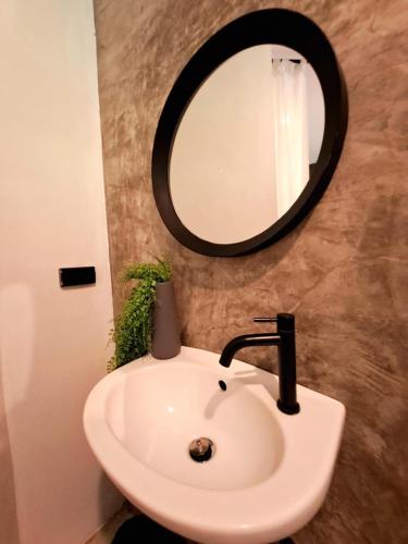 a bathroom with a white sink and a mirror at Alissia House No 516 in Koh Tao