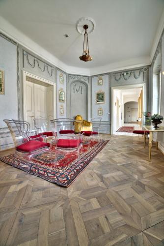 a dining room with a table and chairs at Art Hotel Kaštieľ in Tomášov