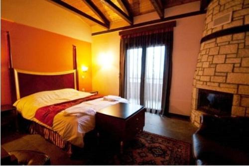Katil atau katil-katil dalam bilik di Ipsivaton Mountain Resort