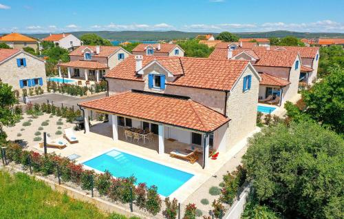 an aerial view of a house with a swimming pool at Lovely Home In Pasman in Pašman