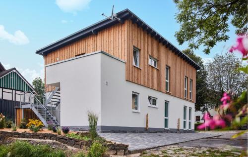 a large white building with a wooden roof at Pet Friendly Apartment In Attendorn in Attendorn