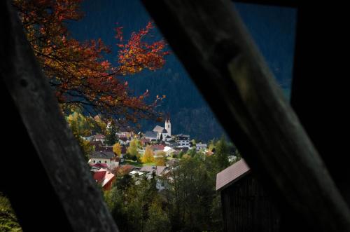 a view of a small town with a church at Apart Zirmegg in Tobadill