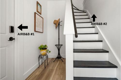 a staircase in a home with two arrows pointing up at 10Guests! Parking 2ND FLOOR-Duplex in Fair Lawn