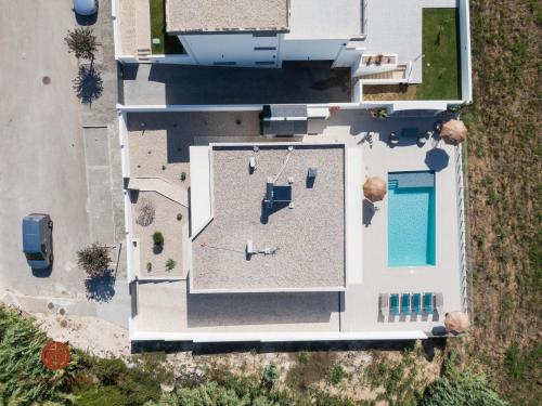 an overhead view of a building with a swimming pool at Casas de Campo - Vale da Terça in Vermelha