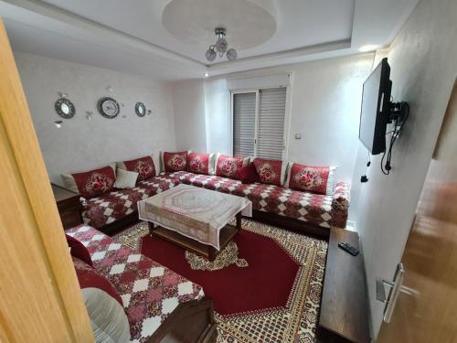 Μια τηλεόραση ή/και κέντρο ψυχαγωγίας στο Appartement perle de bouznika