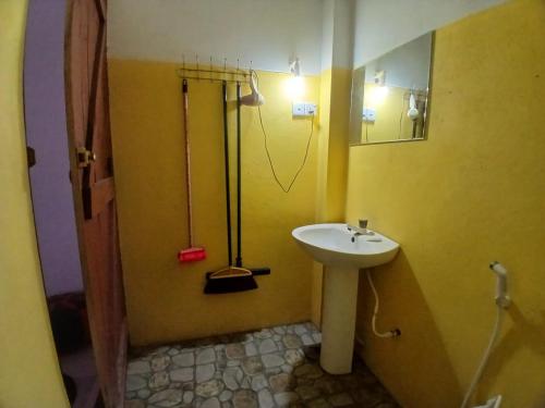 a bathroom with a sink and a shower at Dolphin Village in Kalpitiya