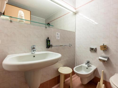 a bathroom with a sink and a toilet at B&B Hotel Borgaro Torinese in Borgaro Torinese